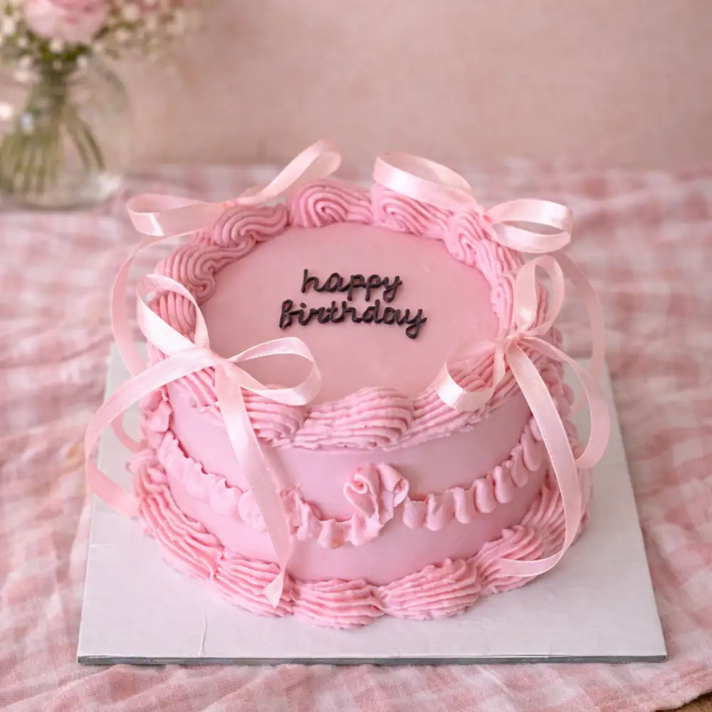 Freshly baked handcrafted Classic Pink Happy Birthday Cake – Cake design by TF Cakes