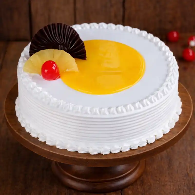 Freshly baked handcrafted Half Glaze Pineapple Cream Cake – Cake design by TF Cakes