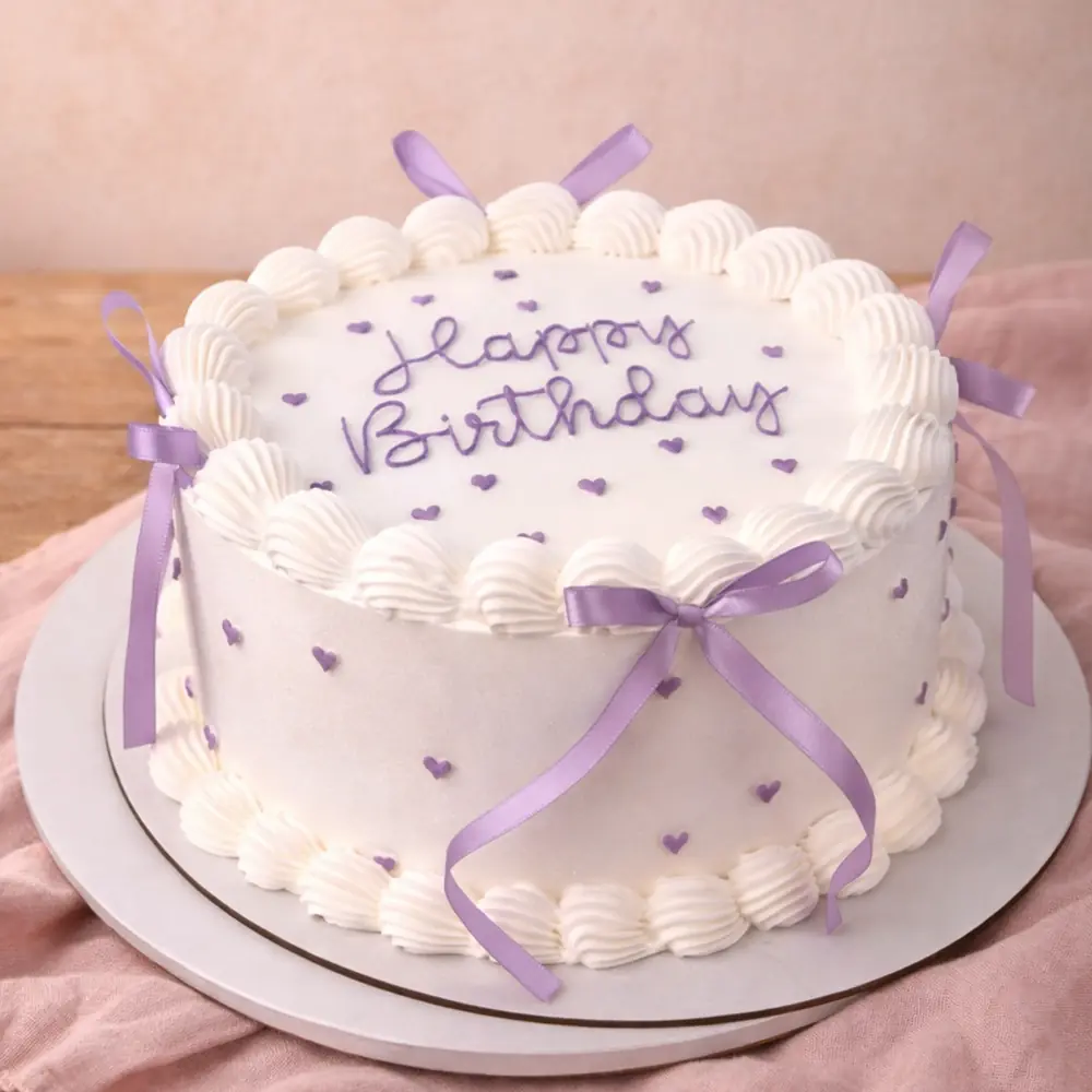 Freshly baked handcrafted Purple Ribbon Vintage Cake – Cake design by TF Cakes