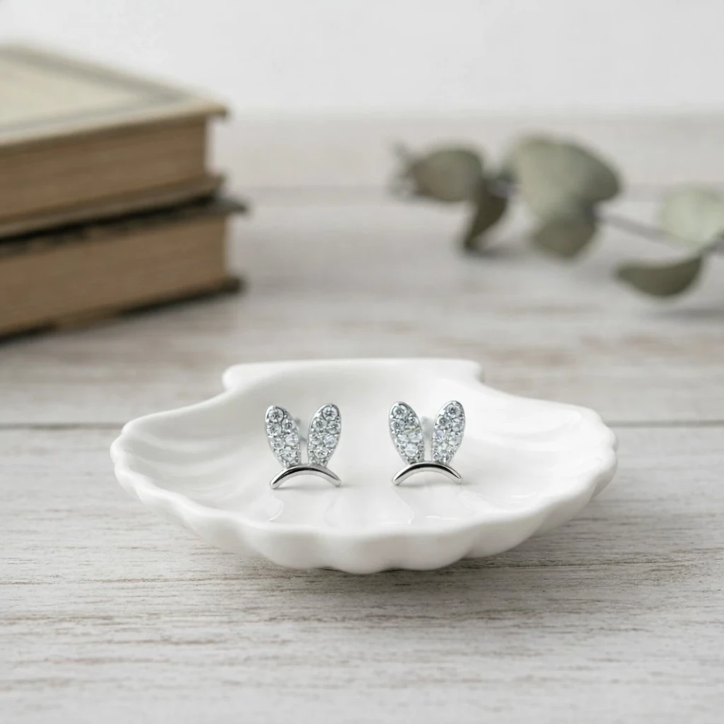 Freshly baked handcrafted Tavira Pure Silver Rhodium plated Bunny Ear Moissanite Diamond Stud – Cake design by TF Cakes